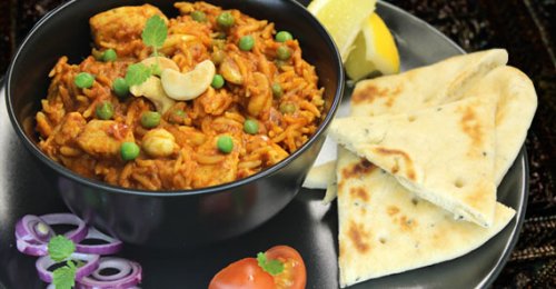 Jugoso pollo al estilo Biryani Delhi